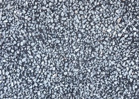 Black stonecrete wall texture with exposed marble aggregate