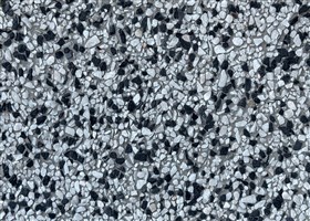 Classic grey grit plaster embedded with visible marble dusk chips, delivering a refined and timeless wall finish