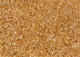 Wall finish in mustard colour with exposed matching mustard aggregates