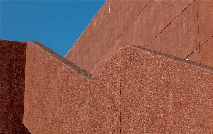 red stonecrete exposed aggregate plaster on bungalow walls